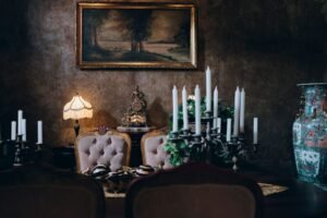 Sophisticated vintage dining room featuring elegant decor, candleholders, and classic artwork. Perfect for a luxurious setting.